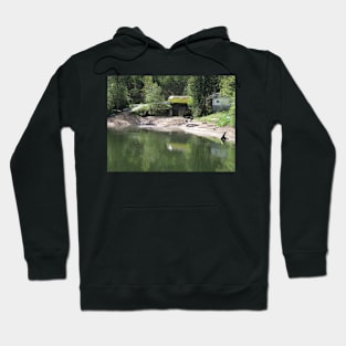 Lake with a bridge with a straw roof Hoodie